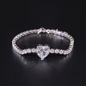 Luxury silver bracelet with large heart-shaped zircon and pave round stones on dark base