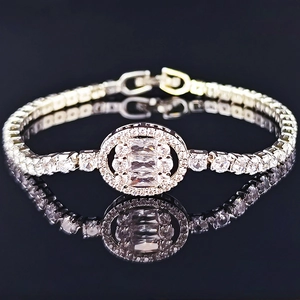 Luxury silver-tone tennis bracelet featuring oval centerpiece with zircon inlay on black surface