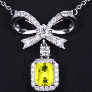 Bowknot necklace with yellow emerald cut gemstone and sparkling zircon crystals