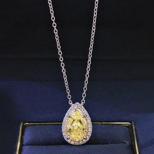 Elegant halo setting necklace featuring a pear-cut yellow gemstone in S925 silver
