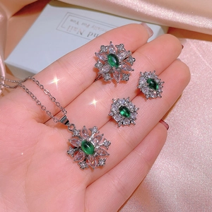 Baroque emerald jewelry set including snowflake pendant necklace, ring, and stud earrings