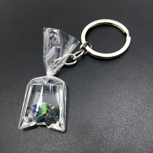 Macro detail of a creative resin fish water bag keychain with a colorful angelfish inside