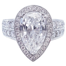 Detailed view of pear shaped cubic zirconia ring with halo setting and paved band