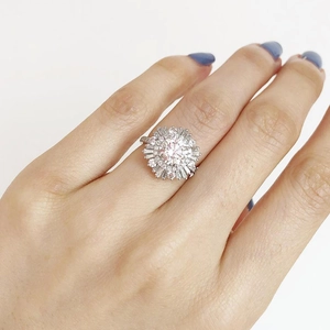 Luxurious silver snowflake ring with central round zircon and baguette diamond halo