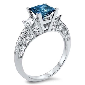 Ring met prinses geslepen blauwe edelsteen en vintage opengewerkt patroon