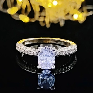 Minimalist 925 silver engagement ring with oval-cut stone and micro-paved band