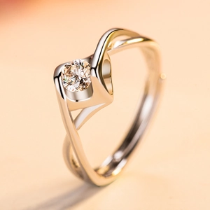 Minimalist silver open ring with twisted band and sparkling round brilliant cut gemstone