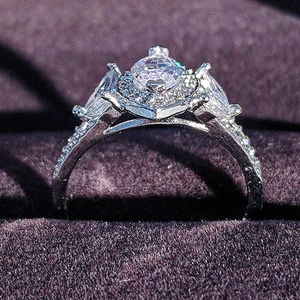 Elegant halo ring with marquise and round cubic zirconia in silver-tone finish