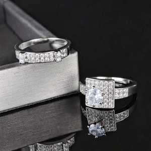 Detailed macro view of silver tone engagement ring set with cubic zirconia pave stones