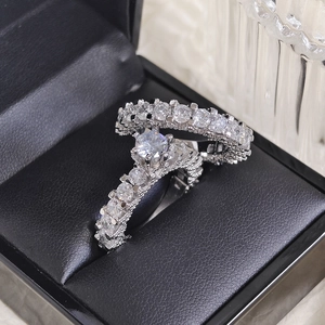Elegant silver wedding ring set with large round diamond and micro-pave band in jewelry box