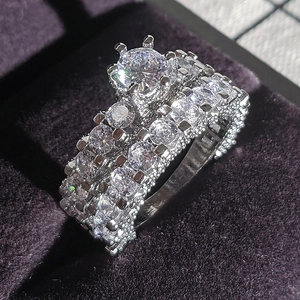 Macro detail of silver vintage engagement ring set with large round zircon in velvet box