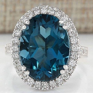 Elegant oval peacock blue zircon halo ring with silver-white band for anniversaries