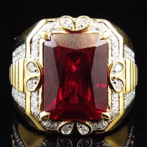 Luxurious gold plated ring featuring a rectangle red ruby and sparkling diamond accents