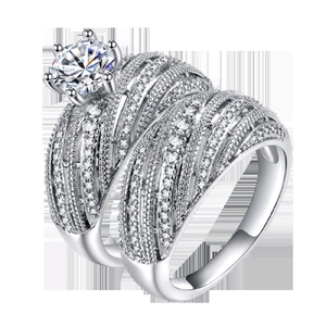 Elegant women's wedding ring set with main six-prong stone and micro-pave bands