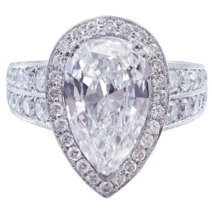 Luxury pear-cut water drop zircon ring with halo setting and pavé crystal wide band