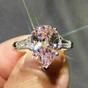 Elegant pear cut pink zircon ring with silver band and side stones for women