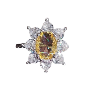 Sunflower design ring with oval yellow zircon center and white teardrop petals