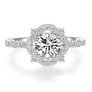 Vintage halo engagement ring with brilliant round center diamond in polished silver band