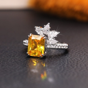 Vintage princess cut yellow zircon flower ring with white diamond pavé in silver finish