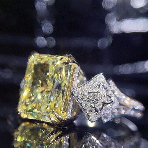 Luxury radiant-cut yellow stone ring with shimmering micro-pave diamond setting