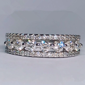 Elegant silver band ring with triple row pave setting and central round clear crystals