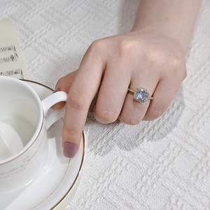 Luxurious cushion-cut lavender ring with halo diamond setting on gold band