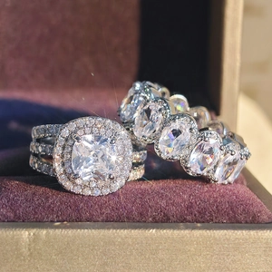 Macro detail of high-end cushion cut and oval zircon rings on a velvet jewelry box