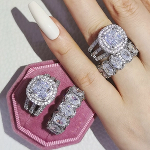 Macro shot of cushion cut emerald-like ring set inside a pink velvet hexagon jewelry box