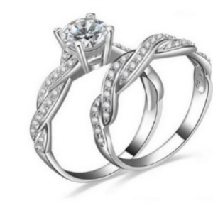 Elegant silver twist bridal set with round solitaire stone and pave side diamonds