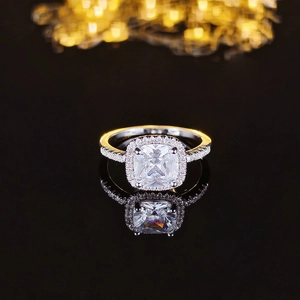 Luxurious cushion cut halo ring with side pave diamonds on polished silver band