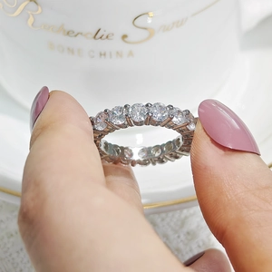 Close-up of sparkling full eternity ring with round-cut cubic zirconia in silver setting