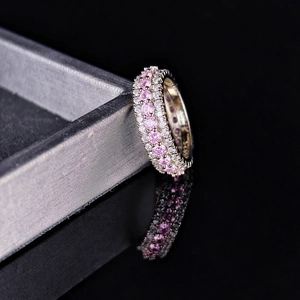 Macro shot of S925 silver ring featuring pink and white zircon stones in micro-pave setting