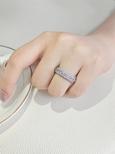 Three-row stackable zircon eternity ring with pink gemstones on model hand