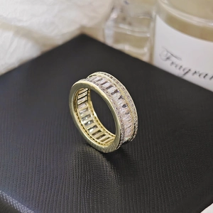 Macro shot of 18K gold plated baguette eternity ring with clear cubic zirconia inlay