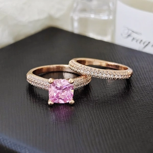 Close-up of pink square stone ring set with rose gold micro-pave detailing