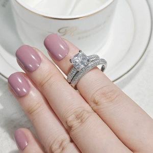 Detailed macro view of square-cut princess diamond ring with micro-pave setting on band