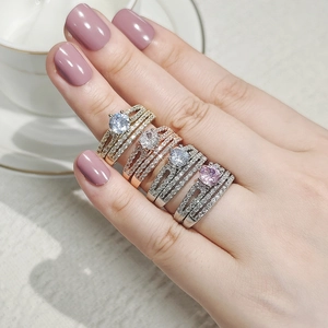 Elegant multi-layer stacked rings with large round main stone in gold and silver finish