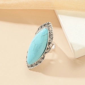 Vintage silver ring with marquise turquoise stone and intricate hollow metal carving