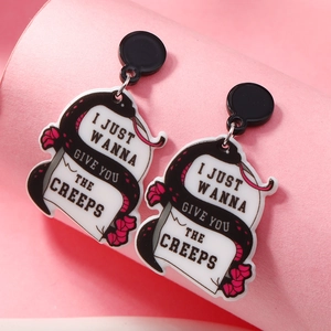 Gothic acrylic serpent earrings with flowers and creepy slogan on pink background