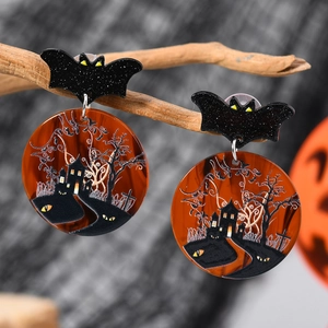Halloween acrylic earrings with black bat shapes and amber haunted house silhouette charms