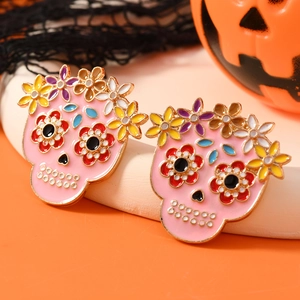 Pink enamel sugar skull earrings with colorful flowers for Halloween and Day of the Dead