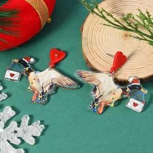 Detail of acrylic flying duck Christmas earrings with light string and heart stud