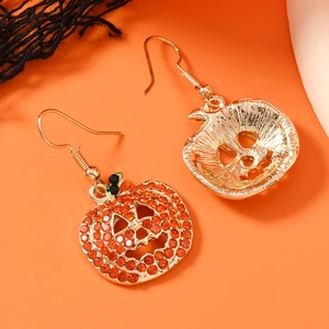 Golden Halloween pumpkin drop earrings with orange rhinestones and green leaf details