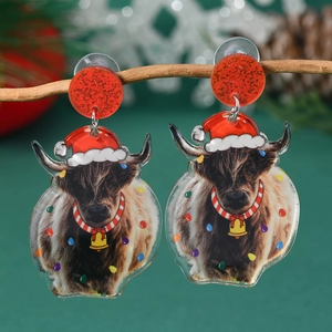 Detail view of acrylic Highland cattle earrings with festive hats on branch