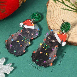 Detail view of acrylic Christmas black cat earrings with festive lights and Santa hat
