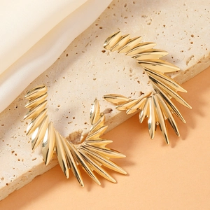 Vintage punk style gold metal radiant wing-shaped earrings for a modern gothic fashion look