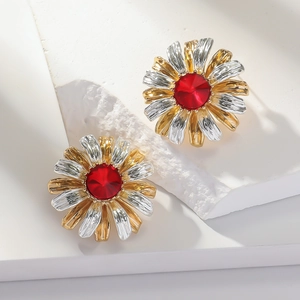 Daisy shaped stud earrings with red crystal center and two-tone gold-silver petals