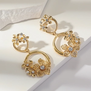 Golden double-loop floral earrings with sparkling rhinestones and hollow petal design