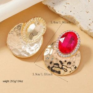 Exaggerated vintage gold alloy earrings with hammered texture and pink oval gemstone