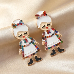 Golden girl brooches with colorful rhinestones on silk background for luxury display